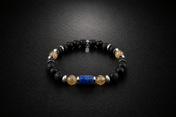B105 – Bransoletka z Lapisu Lazuli, Cytrynu, Onyksu, Lawy Wulkanicznej i Hematytu Bransoletka z naturalnego lapisu lazuli, cytrynu, onyksu, lawy wulkanicznej i hematytu na gumce jubilerskiej ze stalą szlachetną